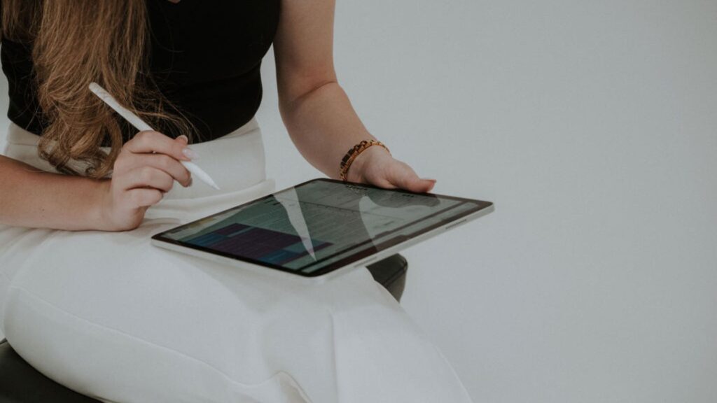 woman working on an ipad